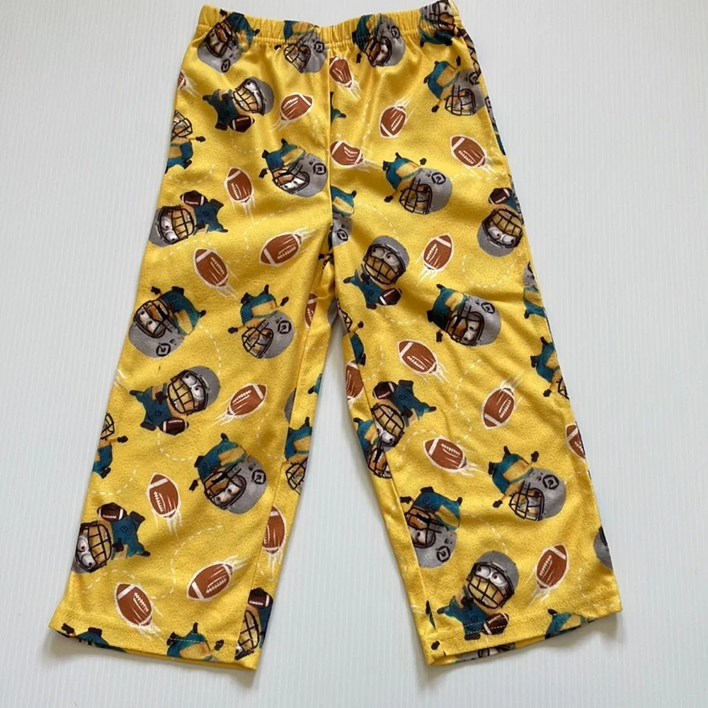 Minions yellow football pajama top & bottoms.  Size 4